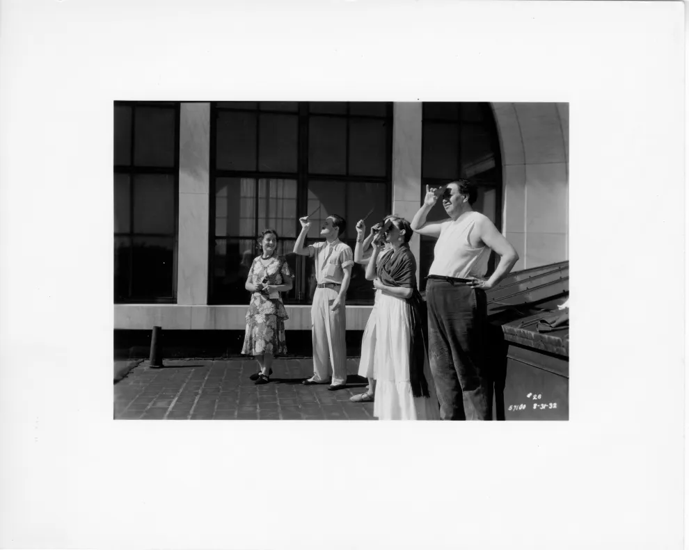 Diego Rivera and Frida Kahlo observing an Eclipse on the roof of the DIA