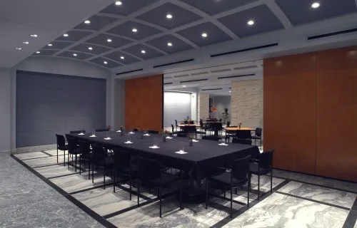 A long table set for a meal pictured inside FJC Dining Room A