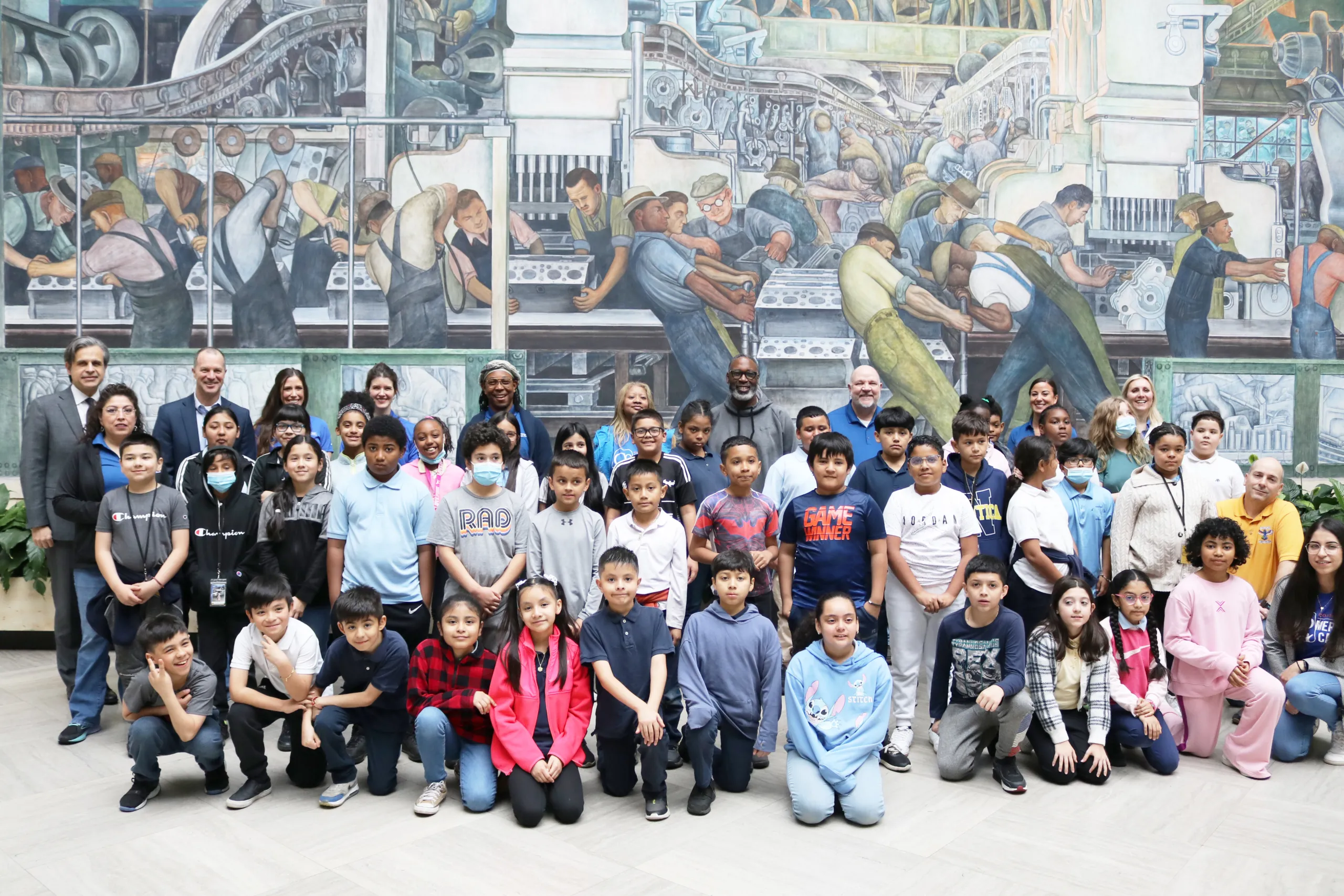 Students from Harms Elementary School and Hope Academy pose with DIA Director Salvador Salort-Pons in the DIA's Rivera Court.