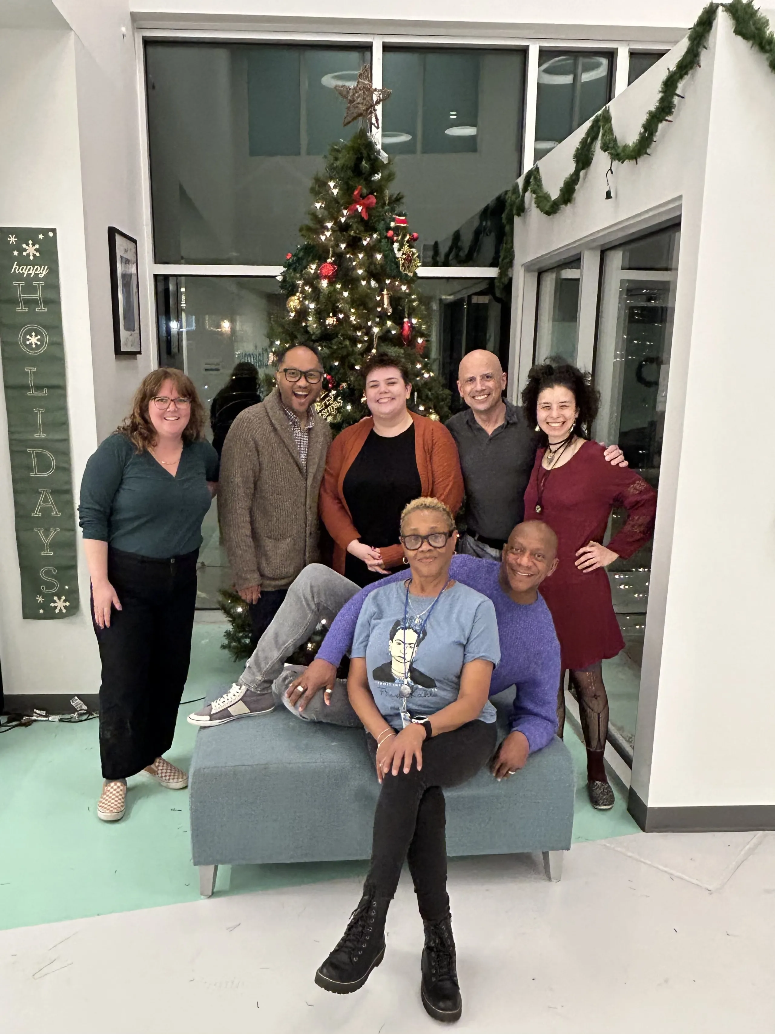 PRISM Leadership and Programming committee pose at the Ruth Ellis Center after holiday decorating.