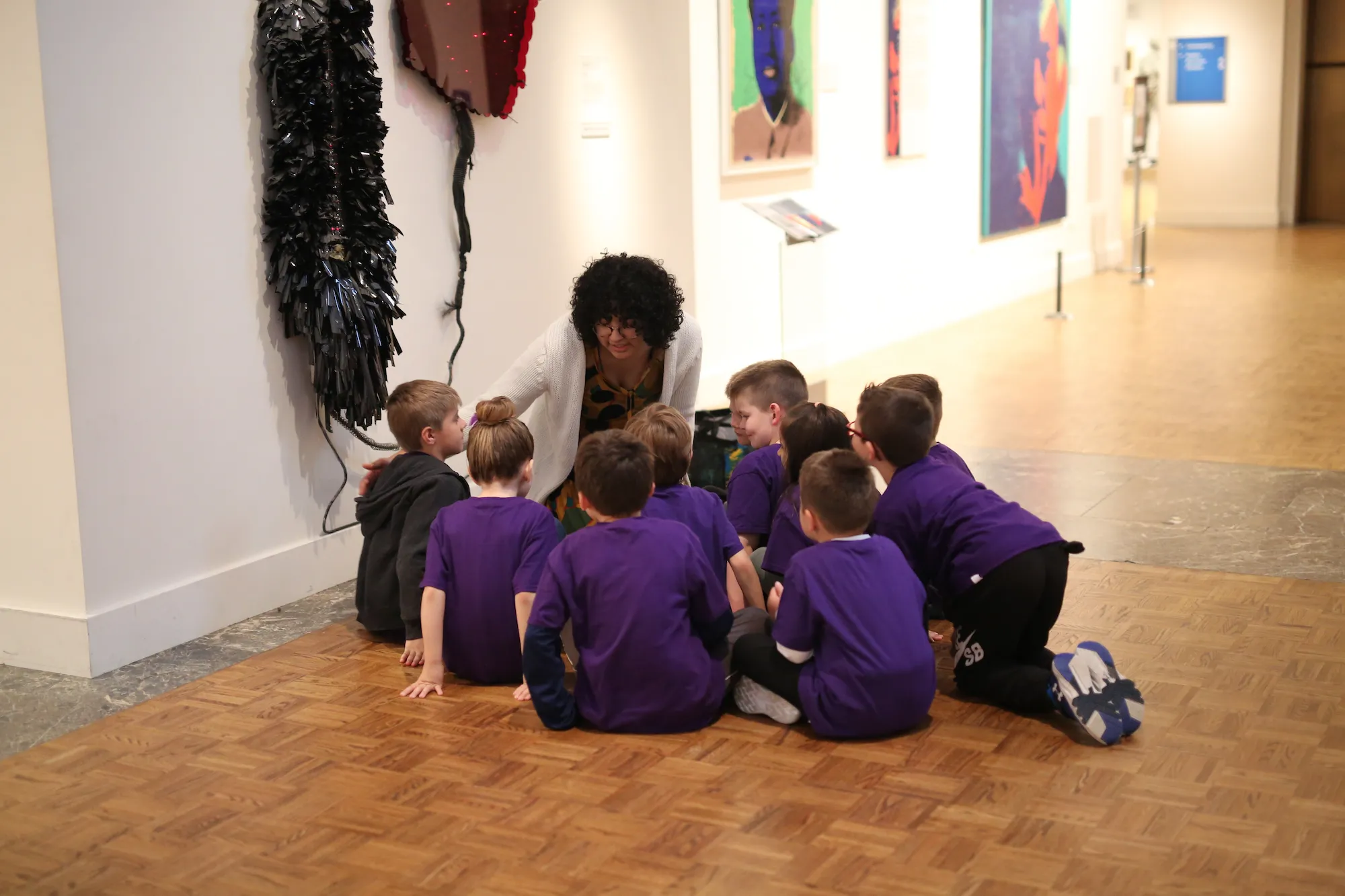 Students learn from a gallery teacher at the DIA