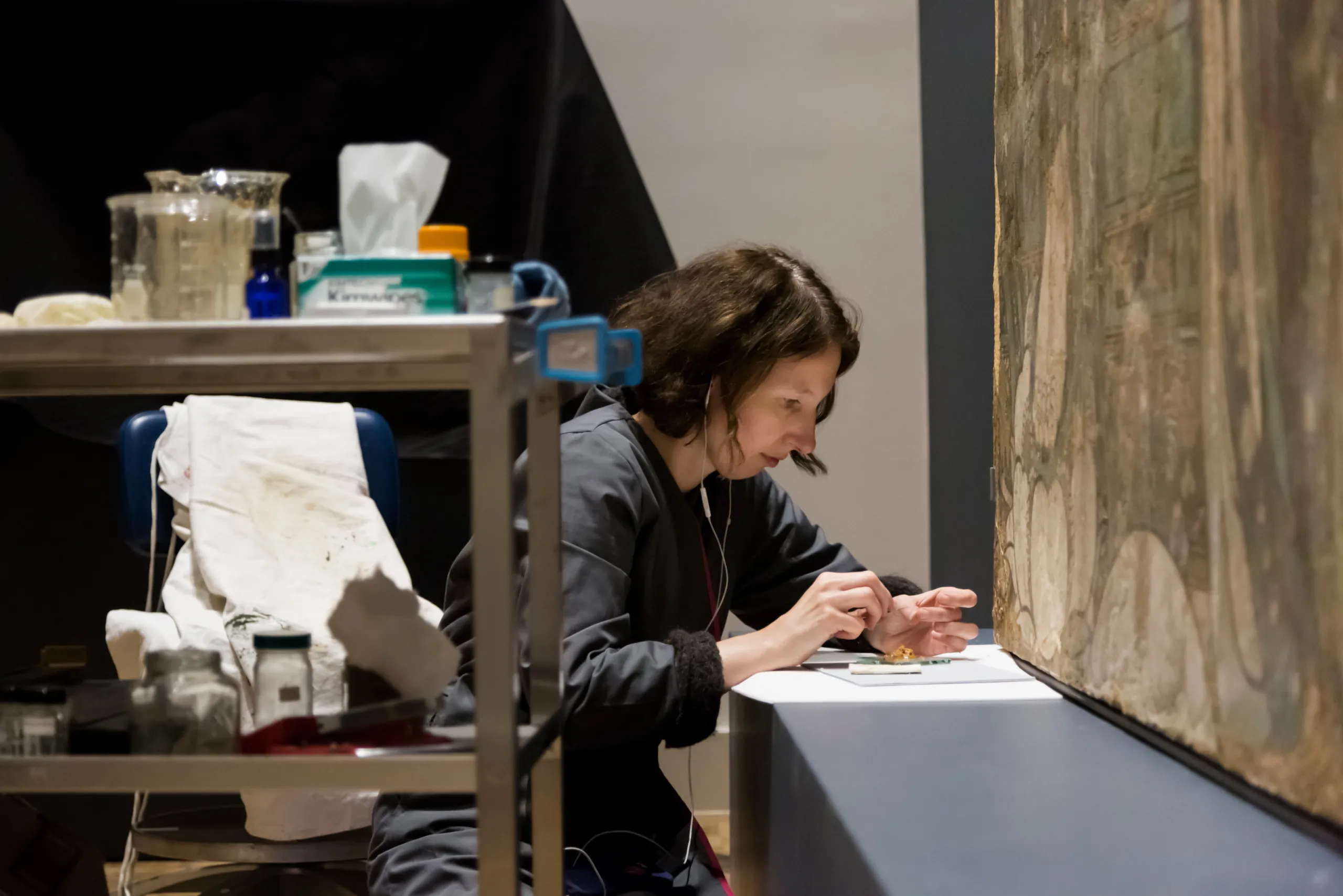 Conservator Ellen Hanspach-Bernal working on a piece