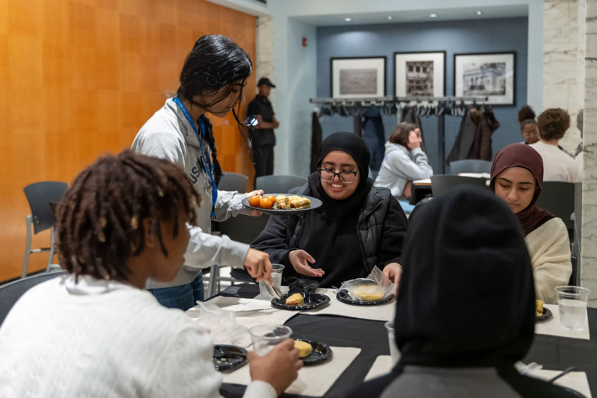 Teens eating together in Dining Rooms A&B
