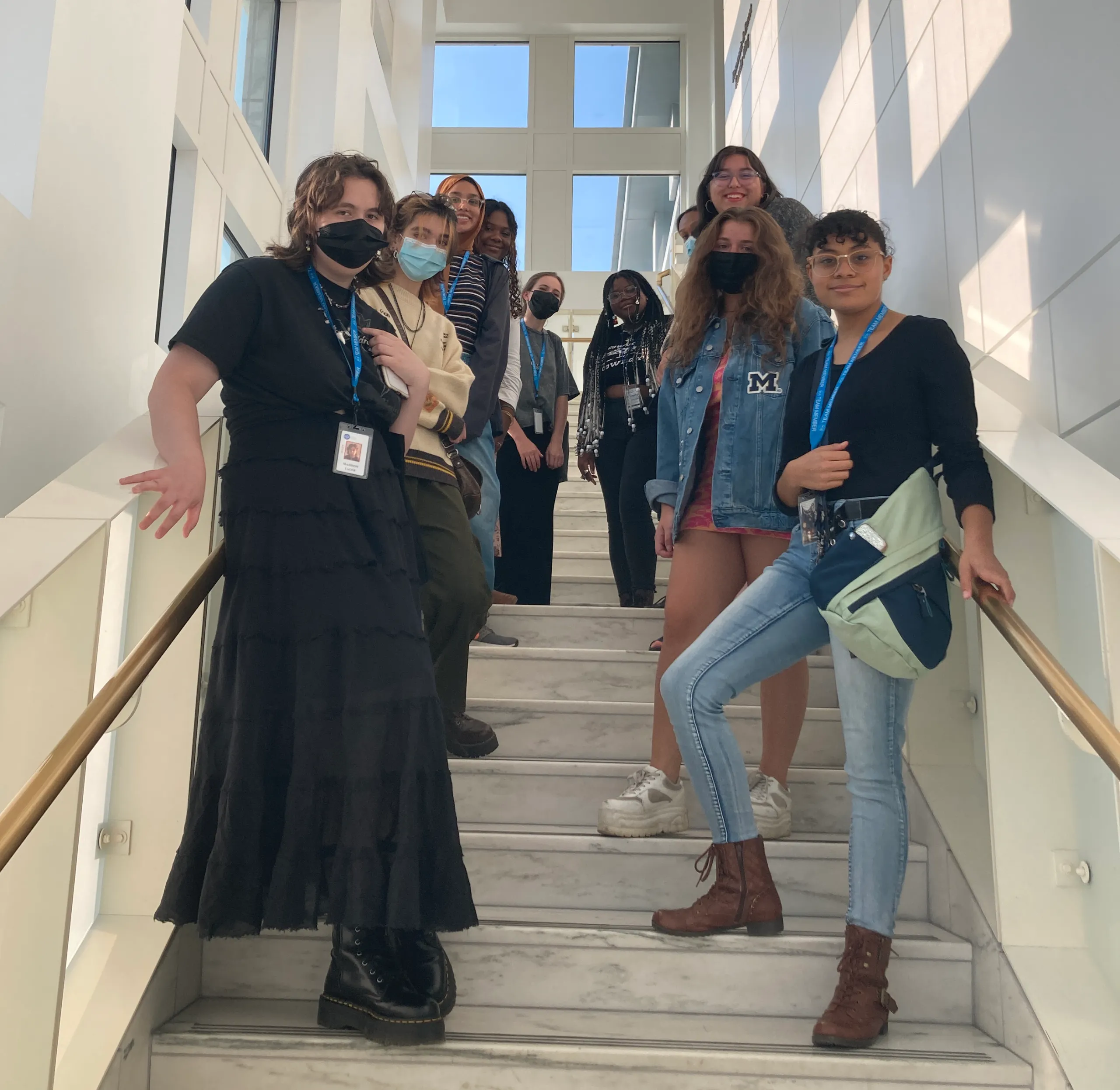 Teen Arts Council posing on stairs in the museum