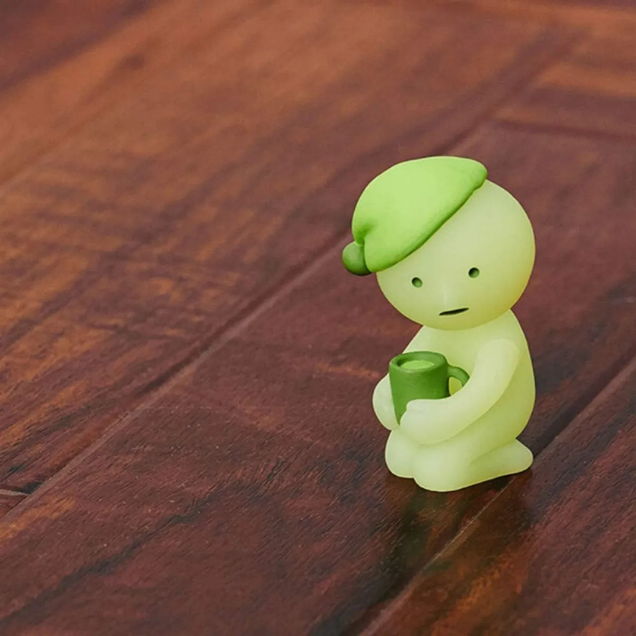 Smiski with a hat and a cup of coffee