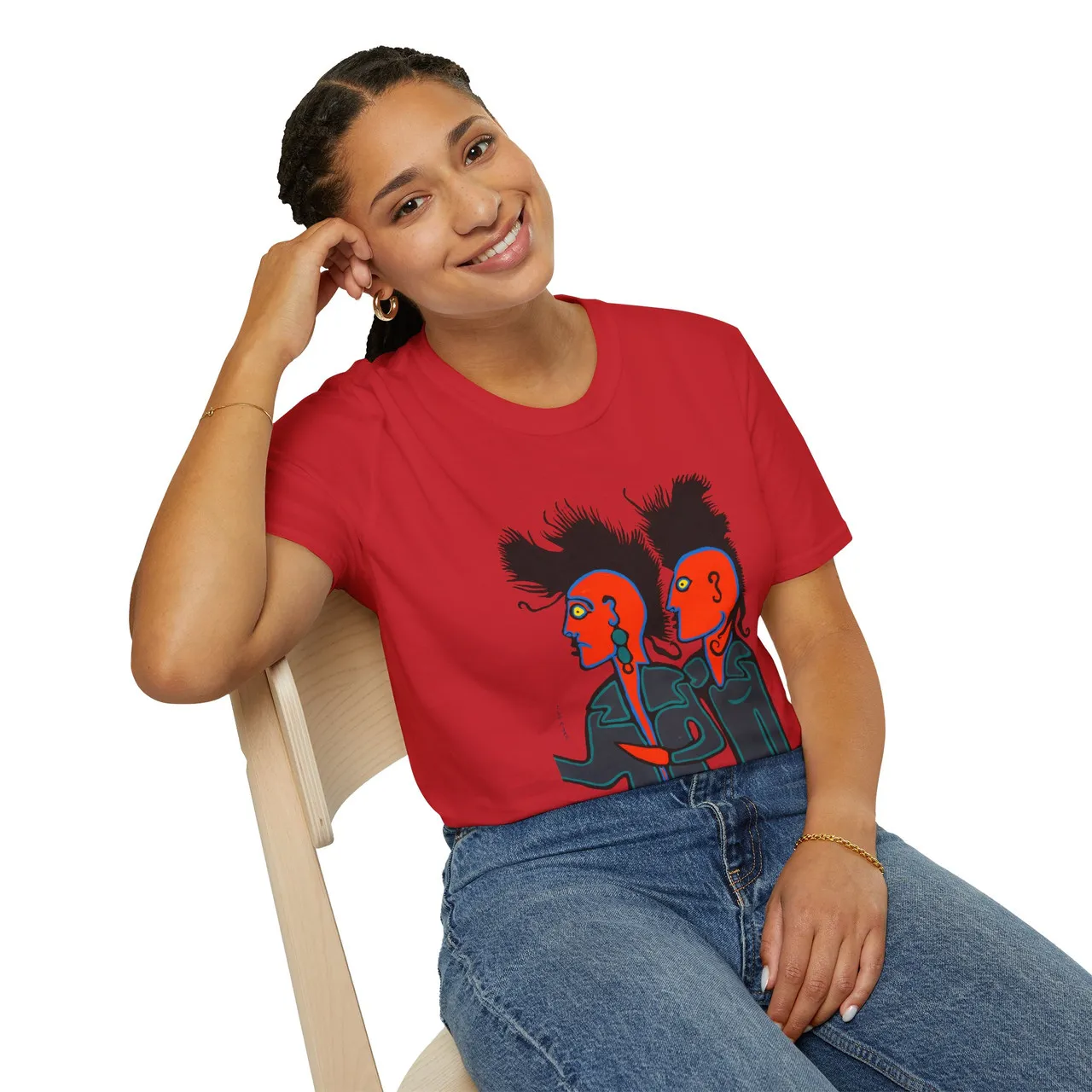 A woman sitting and wearing a Punk Rockers t-shirt