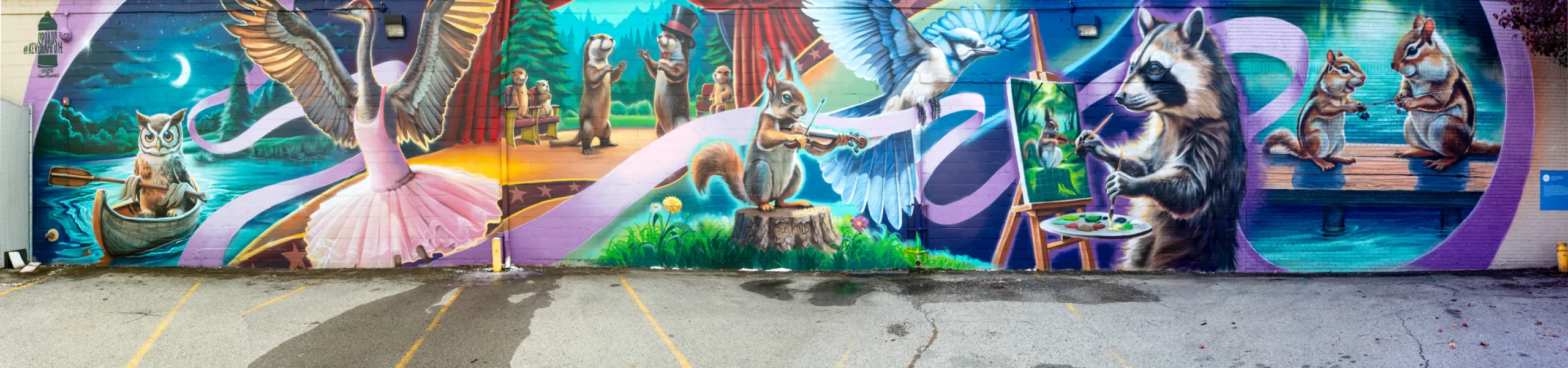 The design includes community responses such as nature and the Detroit River. The theater houses the Downriver Youth Performing Arts Center and therefore there was also a desire to focus the mural on youth and the arts which is demonstrated in this playful and colorful design.