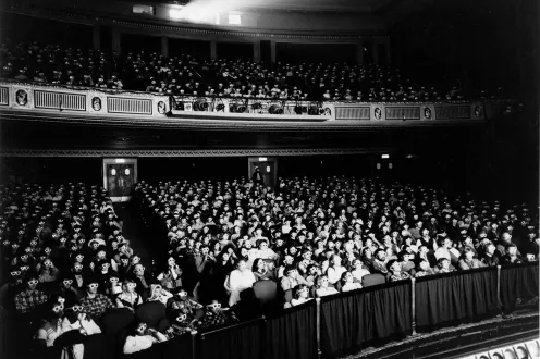 Black and white historical photograph of the audience in the Detroit Film Theatre Auditorium