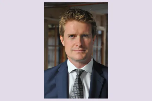 Tristram Hunt pictured in a blue suit and gray tie