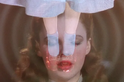 A trippy image featuring Judy Garland as Dorothy and her famous ruby slippers.
