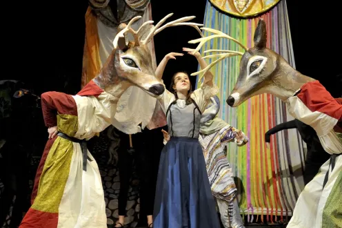 Puppet reindeer in dresses have an argument