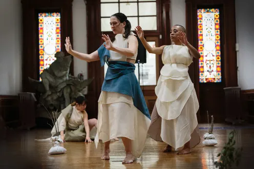 Women dancing in flowing clothes