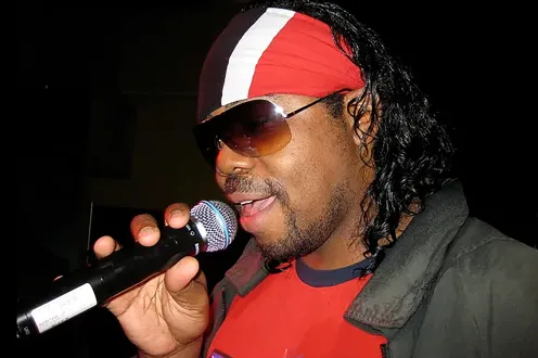Universal Xpression holding a mic