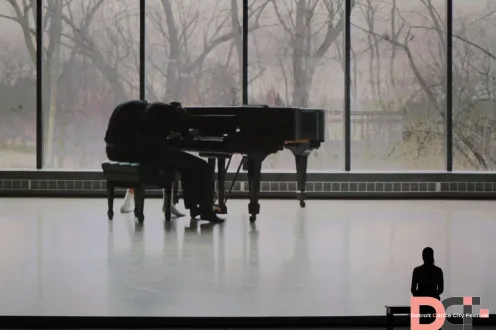 A piano on an empty stage
