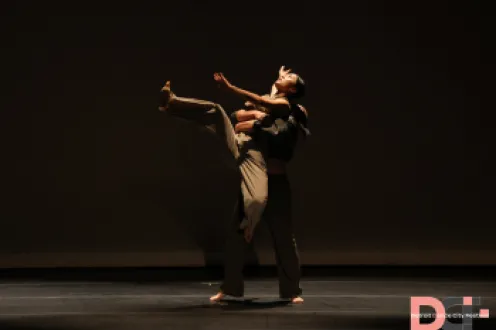 two dancers in sync on stage