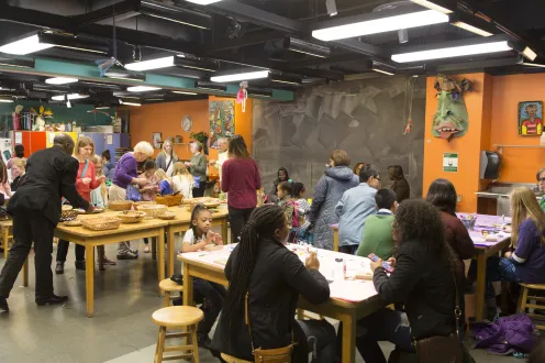 The Detroit Institute of Arts' Artmaking Studio full of guests making art during a drop-in workshop
