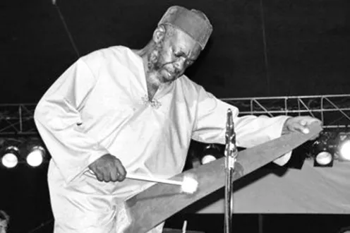 Roy Brooks performing on stage in black and white