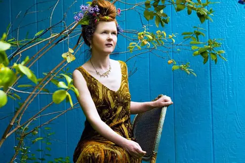 Sarah Cahill poses on a chair