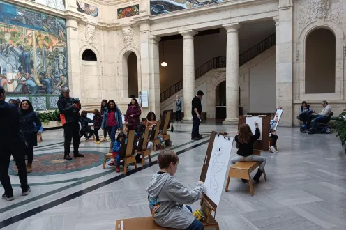 Visitors drawing in Rivera Court