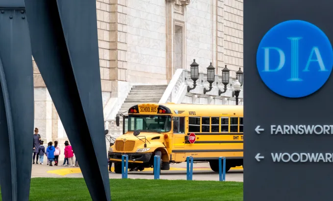 School bus unloading students at the DIA. 