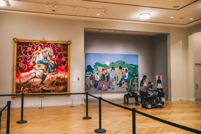A view of Kehinde Wiley&#039;s &quot;Officer of the Hussars&quot; and Romare Bearden&#039;s &quot;Quilting Time&quot; in Kresge Reception