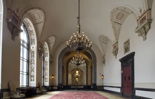 Crystal Gallery, an ornate carpeted room featuring a large chandelier in the center