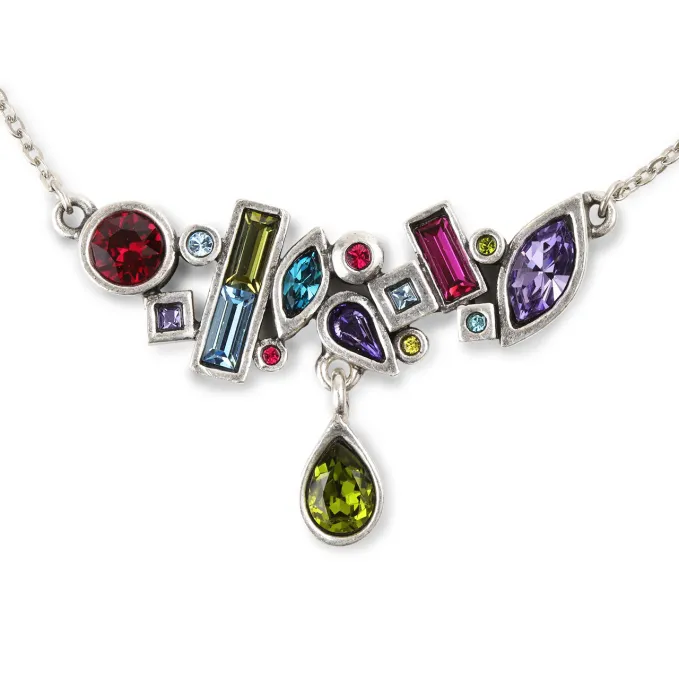 A blend of fine art with a sense of the modern, a combination of organic and geometric forms, the Patricia Locke Aura Necklace in a Fling colorway is cast in pewter and then plated in sterling silver. It is accented with an array of colored Austrian crystals.