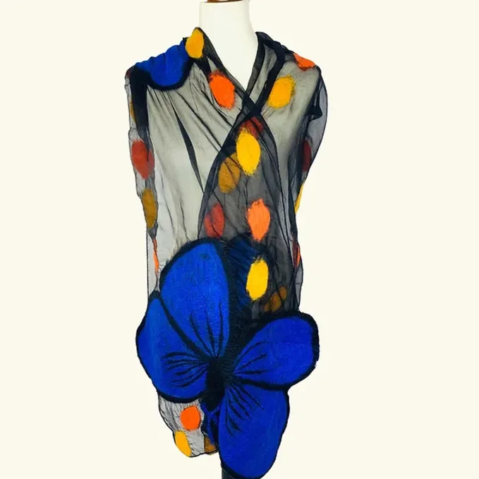 This scarf has bold and beautiful royal blue morpho butterflies with buttercup and orange leaves felted on black silk chiffon.