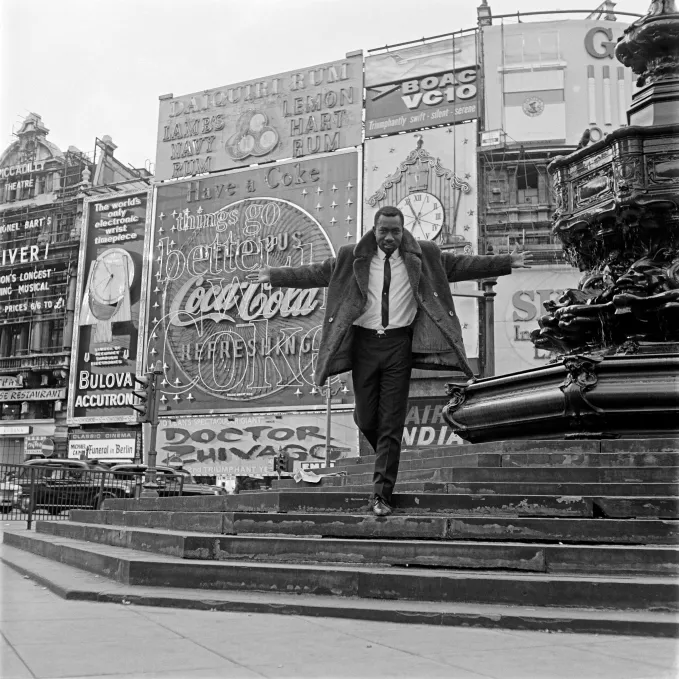 James Barnor (Ghana, b. 1929). Mike Eghan at Piccadilly Circus, London, 1967 (printed 2010–20). Gelatin silver print. Autograph, London.