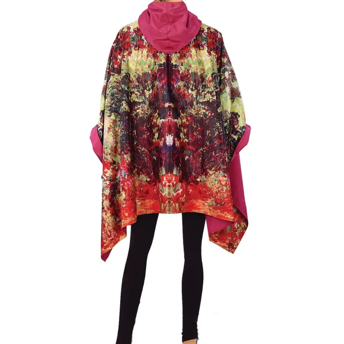 This rain cape has shades of green, red-orange, pink, and purple and was inspired by an oil painting entitled, The Artist’s House From The Rose Garden by French Impressionist artist, Claude Monet (1840-1926). The other side of the cape is a gorgeous solid rose.