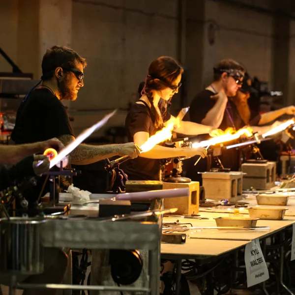 A group of flameworkers at work