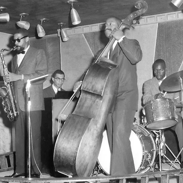 Jazz musicians playing on a small stage