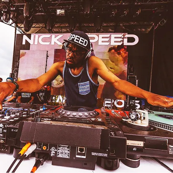 Nick Speed at a DJ table