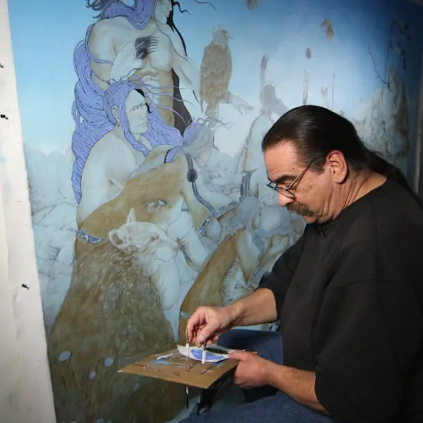 A man painting a mural